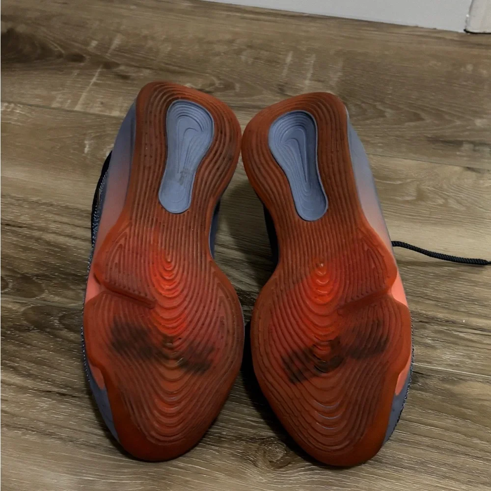 Nike Black Low-Top Sneakers with Orange & Gold Swoosh. Court shoes.
